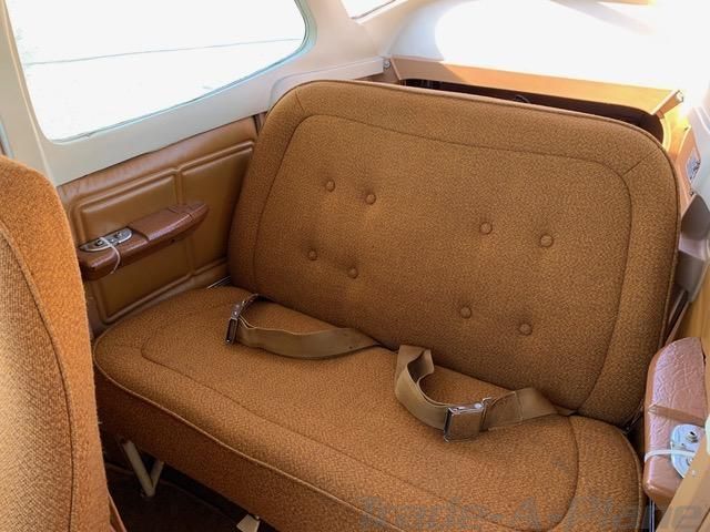 Rear seating area inside Cessna 172N N2723E showing the backseat cabin condition.