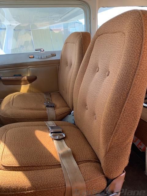 Front cabin seats inside Cessna 172N N2723E showing the condition of the interior.